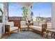 Inviting outdoor patio with comfortable seating and charming decor at 4389 Treadle Sw Rd, Mableton, GA 30126
