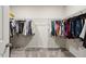 Spacious walk-in closet with ample hanging space and carpeted floors at 4389 Treadle Sw Rd, Mableton, GA 30126