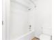 Bathroom with a white tub and toilet and a stainless steel shower head at 1342 Winborn Nw Cir, Kennesaw, GA 30152