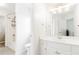 A clean and bright bathroom with white cabinets and a shower-tub combo at 1342 Winborn Nw Cir, Kennesaw, GA 30152