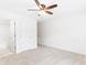 Neutral bedroom featuring a ceiling fan and two white doors, one leading to an ensuite bathroom at 1342 Winborn Nw Cir, Kennesaw, GA 30152