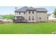 A beautiful home exterior showing a lush green lawn and custom wooden fence enhancing the property's curb appeal at 1342 Winborn Nw Cir, Kennesaw, GA 30152