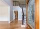 Inviting foyer with hardwood floors, staircase, and decorative glass front door at 1342 Winborn Nw Cir, Kennesaw, GA 30152