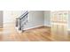 Open foyer with hardwood floors, staircase, and view into adjacent rooms at 1342 Winborn Nw Cir, Kennesaw, GA 30152