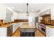 Well-equipped kitchen features granite countertops, stainless steel appliances, and custom cabinetry at 1342 Winborn Nw Cir, Kennesaw, GA 30152