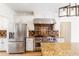Modern kitchen with stainless steel appliances, granite countertops, and a large center island at 1342 Winborn Nw Cir, Kennesaw, GA 30152