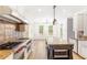 Spacious kitchen featuring a large island, stainless steel appliances, and a professional range at 1342 Winborn Nw Cir, Kennesaw, GA 30152