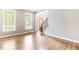 Bright living room with hardwood floors, large windows, and neutral wall color at 1342 Winborn Nw Cir, Kennesaw, GA 30152