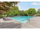 Enjoy the outdoors with this beautiful swimming pool surrounded by lush greenery and comfortable lounge chairs at 1342 Winborn Nw Cir, Kennesaw, GA 30152