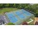 A view of community tennis courts with well maintained surface and lighting for daytime or evening play at 1342 Winborn Nw Cir, Kennesaw, GA 30152