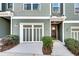 Exterior of a townhome featuring an attached garage and a neutral color scheme at 1365 Memorial Se Dr # 8, Atlanta, GA 30317