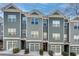 Charming townhomes boast a modern facade with a mix of siding and shingle textures plus attached garages at 1365 Memorial Se Dr # 8, Atlanta, GA 30317