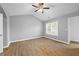 Spacious primary bedroom with vaulted ceiling, wood floors, and ample natural light at 2727 Northgate Nw Way, Acworth, GA 30101