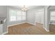 Dining area with wood floors, natural light, and access to closet and kitchen at 2727 Northgate Nw Way, Acworth, GA 30101