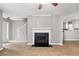Cozy living area featuring a fireplace, modern flooring, and easy access to the kitchen at 2727 Northgate Nw Way, Acworth, GA 30101