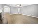 Spacious living room featuring modern gray walls, updated flooring, and ample natural light at 2727 Northgate Nw Way, Acworth, GA 30101