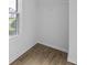 Walk-in closet with ample storage space, wooden floors and a window for natural light at 2727 Northgate Nw Way, Acworth, GA 30101
