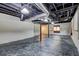 Unfinished basement featuring concrete floor, exposed ducts and beams, and black support columns at 3341 Rae Pl, Lawrenceville, GA 30044