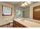 Bathroom featuring a vanity with countertop sink and a framed mirror at 3341 Rae Pl, Lawrenceville, GA 30044