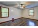 Spacious bedroom featuring hardwood floors, ceiling fan, and natural light at 3341 Rae Pl, Lawrenceville, GA 30044