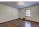 Modest bedroom featuring hardwood floors, neutral walls, and a sunny window at 3341 Rae Pl, Lawrenceville, GA 30044