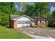 Lovely single-story brick home featuring an attached garage and tidy front yard at 3341 Rae Pl, Lawrenceville, GA 30044