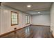 Bright living area featuring hardwood floors, ample natural light, and neutral wall paint at 3341 Rae Pl, Lawrenceville, GA 30044