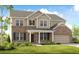 Two-story home with a brick and siding exterior, attached garage, and manicured front lawn at 5335 Trescott Path, Cumming, GA 30028