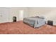 Large bedroom with neutral walls and carpeting at 9010 Jim Purcell Dr, Covington, GA 30014