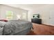 Bright, spacious bedroom featuring two windows for natural light and a comfortable, cozy feel at 9010 Jim Purcell Dr, Covington, GA 30014
