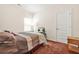 Cozy bedroom with neutral walls, a large window, and comfortable carpeting at 9010 Jim Purcell Dr, Covington, GA 30014