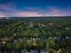 Breathtaking aerial view showcasing a residential neighborhood surrounded by dense forestry at 2040 Parliament Dr, Lawrenceville, GA 30043