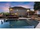 A large backyard with a pool, deck, and screened-in porch creates an inviting outdoor oasis for entertaining at 2040 Parliament Dr, Lawrenceville, GA 30043
