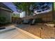 Tranquil backyard retreat with seating area, gravel landscaping, and subtle accent lighting at 2040 Parliament Dr, Lawrenceville, GA 30043