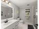 Stylish bathroom featuring a modern vanity, glass-enclosed shower, and tiled floors at 2040 Parliament Dr, Lawrenceville, GA 30043