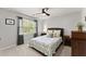 Serene bedroom with ceiling fan, large window, and calming decor at 2040 Parliament Dr, Lawrenceville, GA 30043