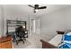 Bedroom with dark wood floors, ceiling fan, a workspace, and decor shelving at 2040 Parliament Dr, Lawrenceville, GA 30043