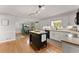 Open-concept kitchen featuring a butcher block island, modern appliances, and seamless flow into dining area at 2040 Parliament Dr, Lawrenceville, GA 30043
