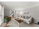 Comfortable living room with plush sofa, neutral decor, and sun-filled windows at 2040 Parliament Dr, Lawrenceville, GA 30043
