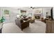 Spacious living room with a brick fireplace, comfortable seating, and neutral décor at 2040 Parliament Dr, Lawrenceville, GA 30043