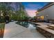 Relaxing pool area with lounge chairs, hot tub, and ample space for entertaining next to the home at 2040 Parliament Dr, Lawrenceville, GA 30043
