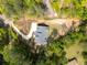 An aerial view of a house showcasing its roof, driveway, and surrounding greenery at 2841 Bettis Ct, Marietta, GA 30066