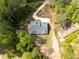 Overhead view showcasing a home with a winding driveway and surrounded by mature trees and landscaping at 2841 Bettis Ct, Marietta, GA 30066