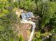 Aerial shot of house with winding driveway, beautiful landscaping, and lush surroundings at 2841 Bettis Ct, Marietta, GA 30066