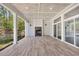Covered back porch with outdoor fireplace and sliding doors to the yard at 2841 Bettis Ct, Marietta, GA 30066