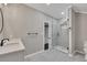 Bright bathroom featuring a glass shower, modern sink and fixtures at 2841 Bettis Ct, Marietta, GA 30066