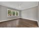 A bright and airy bedroom with hardwood floors and large windows offering natural light and views at 2841 Bettis Ct, Marietta, GA 30066
