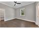 Spacious bedroom featuring neutral colors, hard wood floors and a large window at 2841 Bettis Ct, Marietta, GA 30066