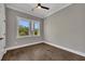 Bedroom with dark wood floors, gray walls, and natural light from the large windows at 2841 Bettis Ct, Marietta, GA 30066