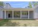 Covered patio with outdoor fireplace and sliding glass doors, perfect for entertaining at 2841 Bettis Ct, Marietta, GA 30066